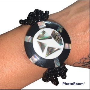Unique black beaded bracelet with multi colour chrome face